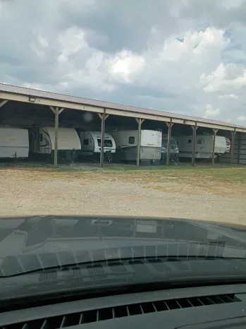 Covered canopy bays with rigs parked at Quiet Stay in Morrison, Oklahoma